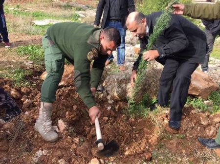 قوات الأمن الوطني الفلسطيني تشارك في اليوم الوطني لغرس الأشجار في بلدة الجلمة